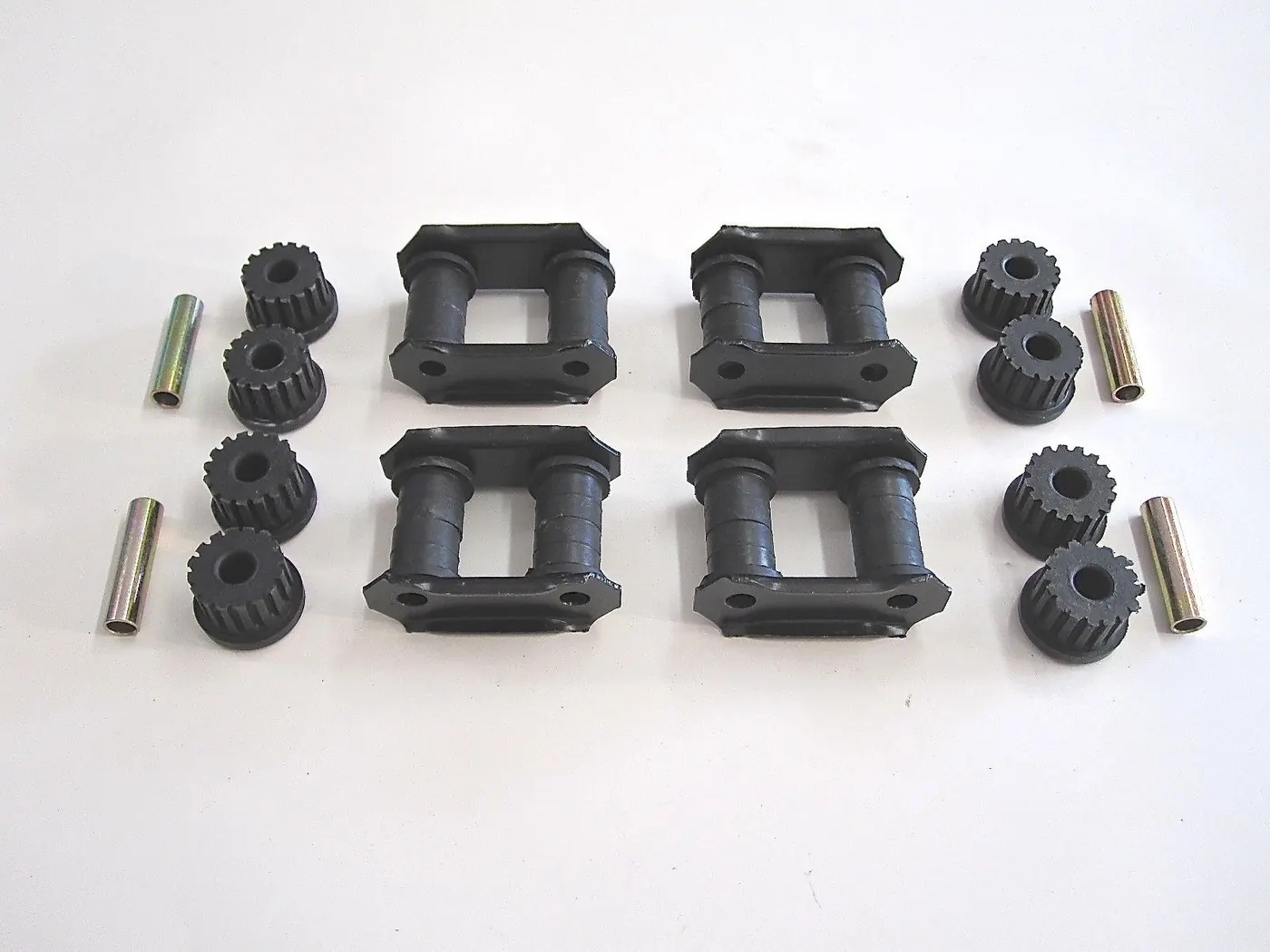 COMPLETE SET – LEAF SPRING SHACKLES / BUSHINGS (OEM) – SAMURAI ’80-’95